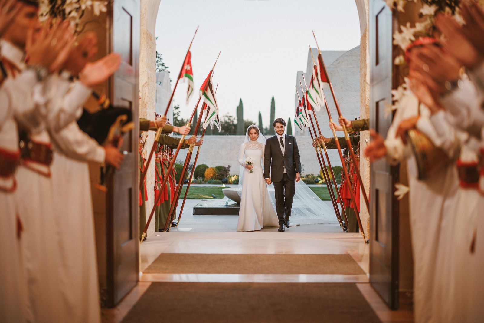 The newlyweds processing handinhand during the wedding ceremony