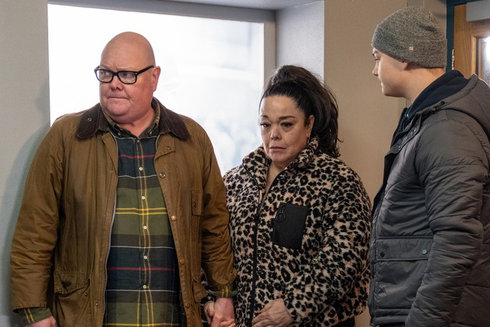 A sad Mandy stands between Paddy and Dylan in Emmerdale