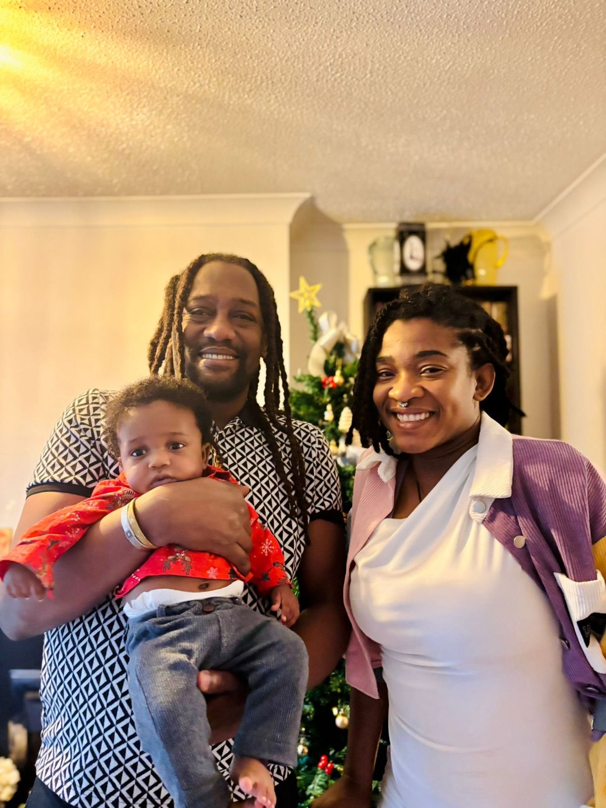 Junia Van Belle and her partner and child 