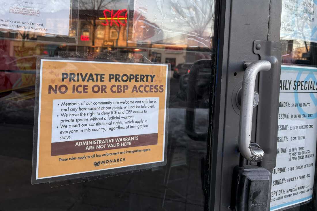 Stores in Minneapolis have posted signs supporting immigrants in the community, attempting to bar federal agents from entering.