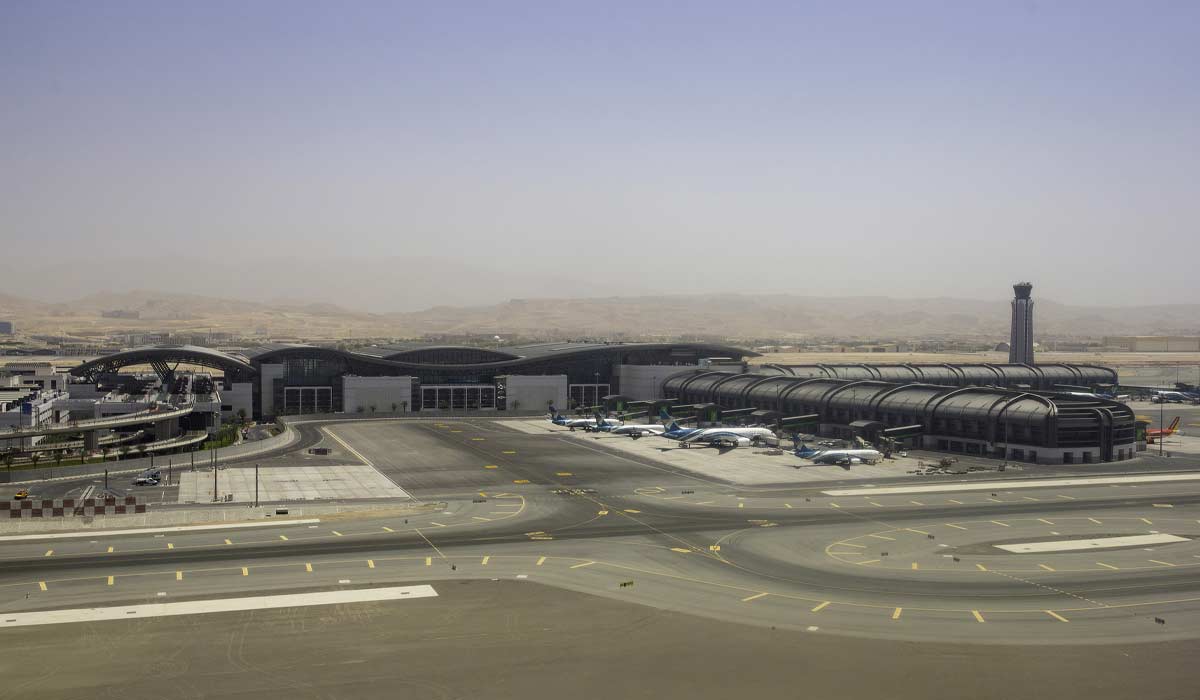 Airliners operated by Oman Air stand beside the passenger terminal at Muscat International Airport in Muscat, Oman, on Monday, May 7, 2018. Being the Switzerland of the Gulf served the country well over the decades, helping the sultanate survive, thrive and make it a key conduit for trade and diplomacy in the turbulent Middle East. Photographer: Christopher Pike/Bloomberg via Getty Images