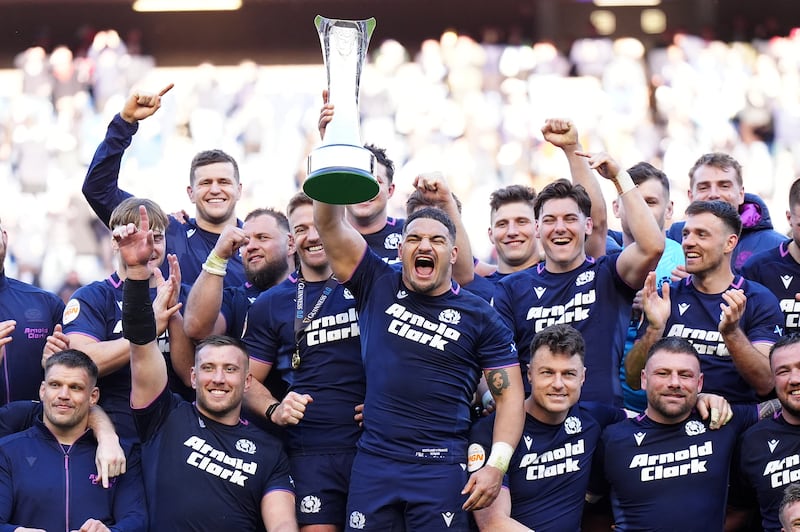 Scotland captain Sione Tuipulotu lifts the Auld Alliance Trophy after the win over France at Murrayfield. Photograph: Jane Barlow/PA Wire