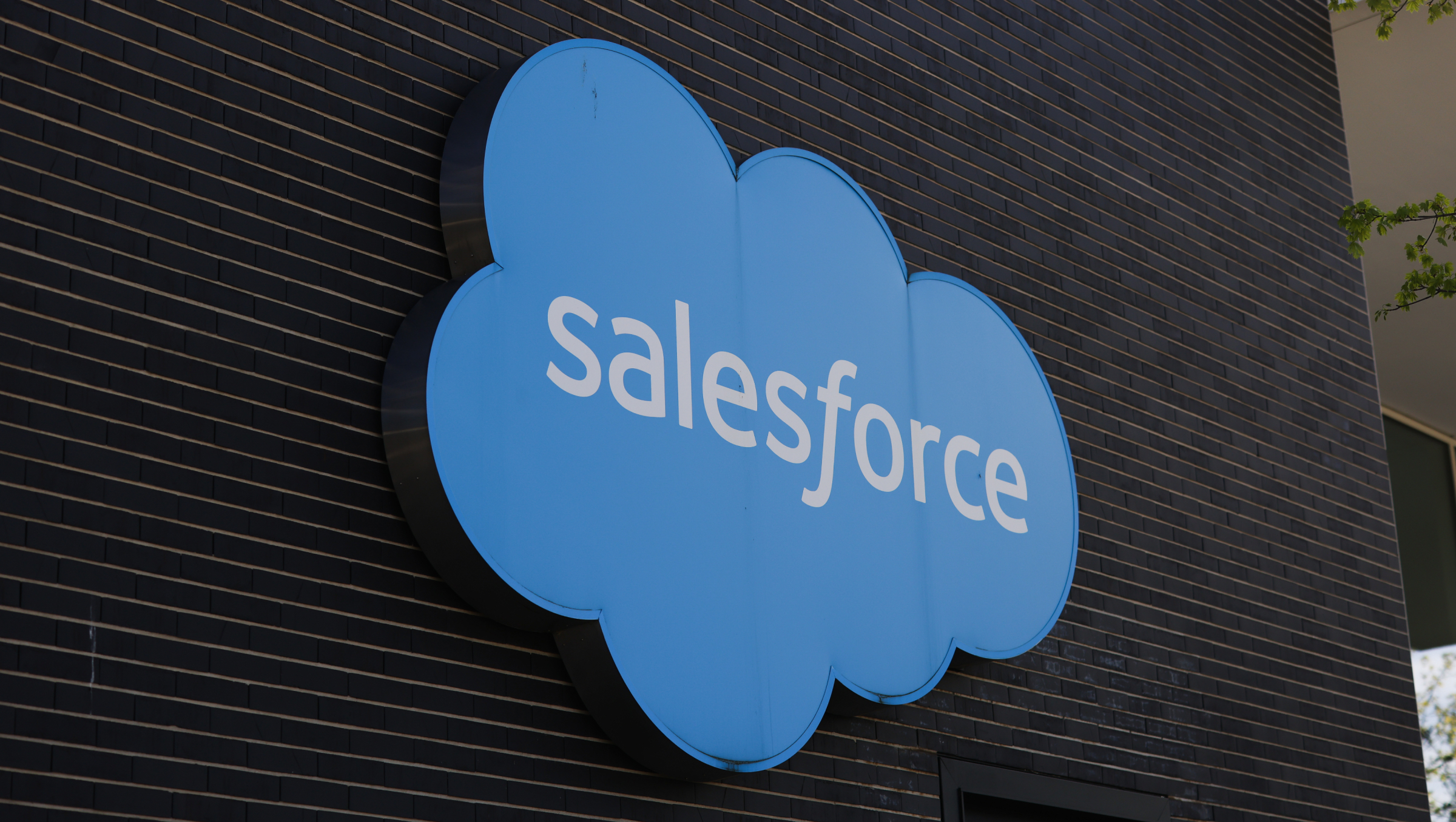A Salesforce sign outside building exterior.