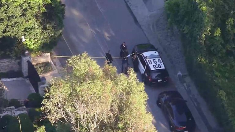Police outside the property on Sunday. Pic: KNBC