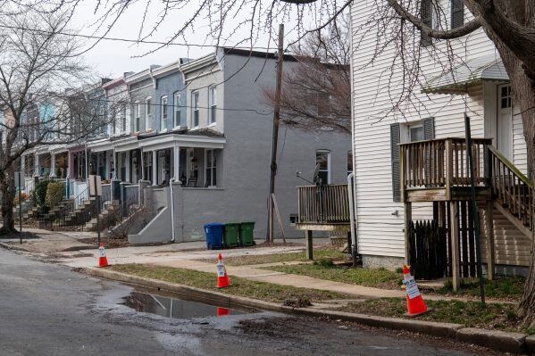 Cones sit near an area of Baltimore that previously suffered a sewage backup on March 5, 2026. (AP Photo/Michael Phillis)