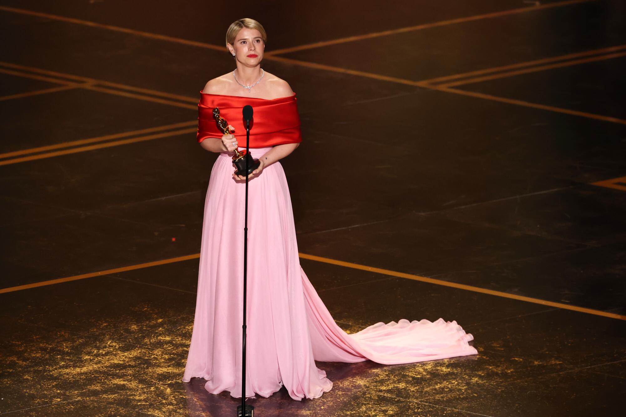 Jessie Buckley accepts the Oscar for lead actress for "Hamnet."