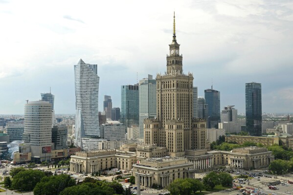 Newer skyscrapers flank the communist-era Palace of Culture and Science, foreground, in n, Poland, May 25, 2018. (AP Photo/Alik Keplicz, File)