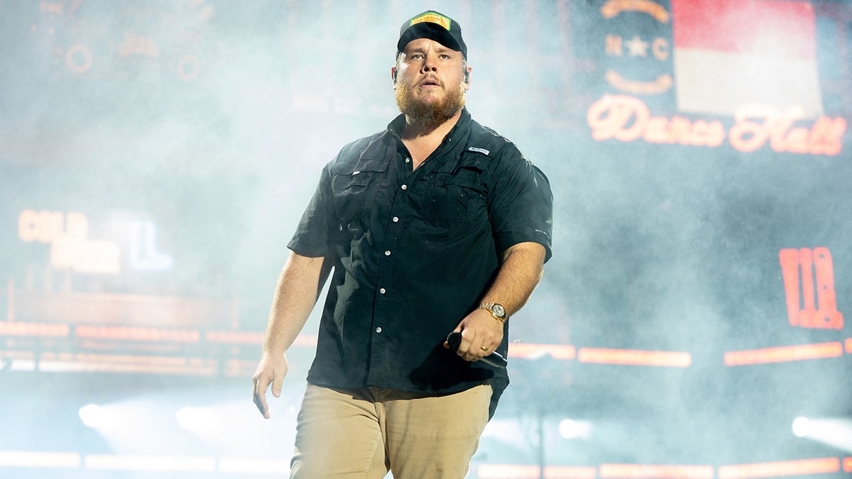 Luke Combs performing onstage at Lollapalooza in Grant Park, Chicago, on July 31, 2025.