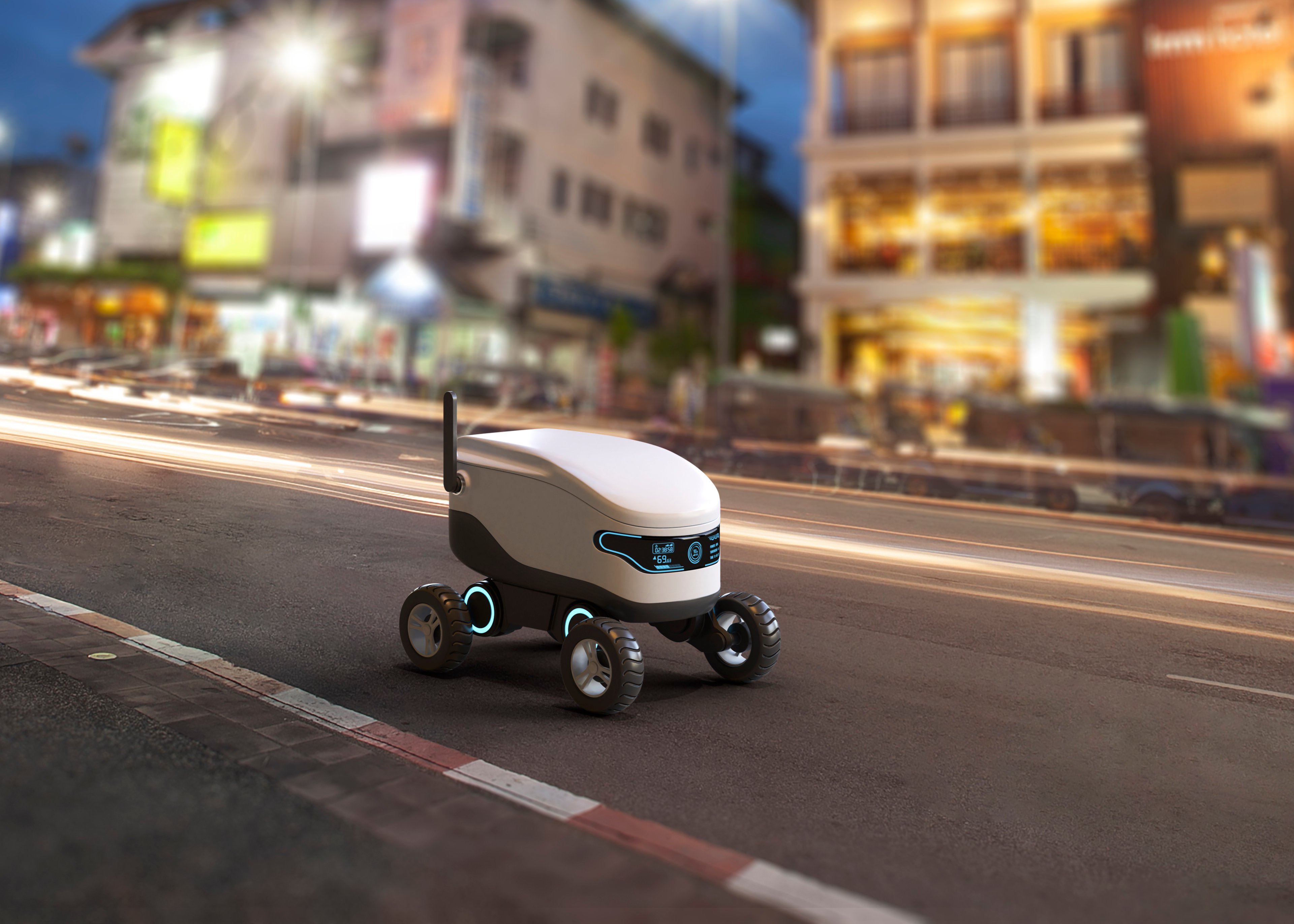 An autonomous delivery robot driving along the sidewalk.