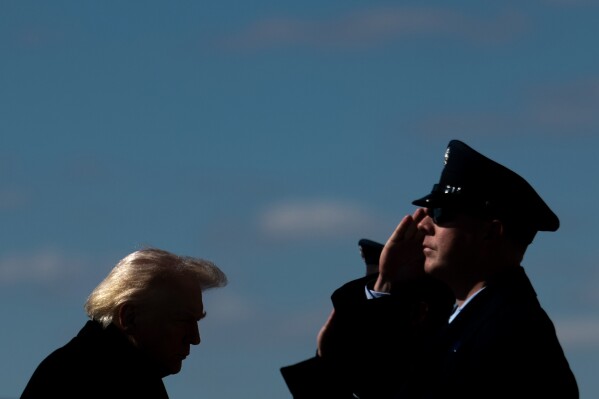 President Donald Trump walks to board Air Force One at Dover Air Force Base, Del., Wednesday, March 18, 2026, after attending the casualty return for the six crew members of an Air Force refueling aircraft who died when their plane crashed in western Iraq while supporting operations against Iran. (AP Photo/Julia Demaree Nikhinson)