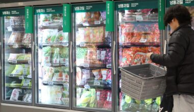 A shopper walks down the frozen aisle at a supermarket in Seoul. Yonhap