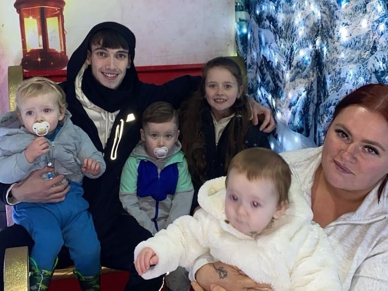 Jayden and Nevaeh O'Neill (centre), who fell from a second-floor balcony in Waterford on Friday, with their father Ryan O'Neill, mother Regina Smith, and siblings Jaxson (far left) and Alliyah (far right). Photograph courtesy of Regina Smith