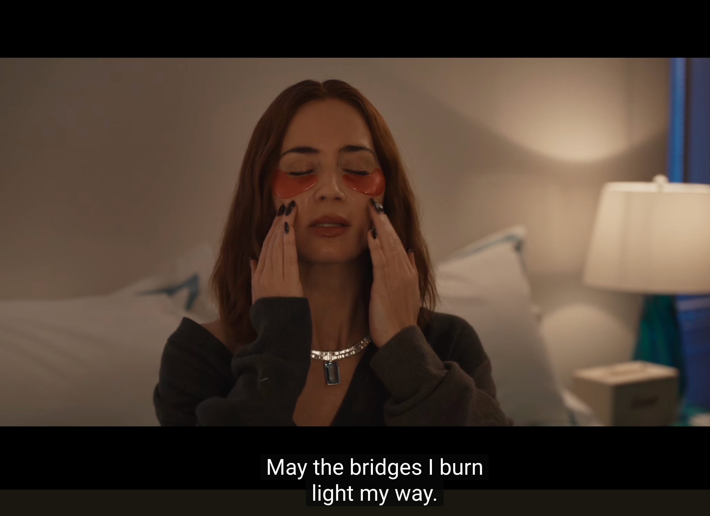 a woman expresses herself in a thoughtful manner adorned with jewelry