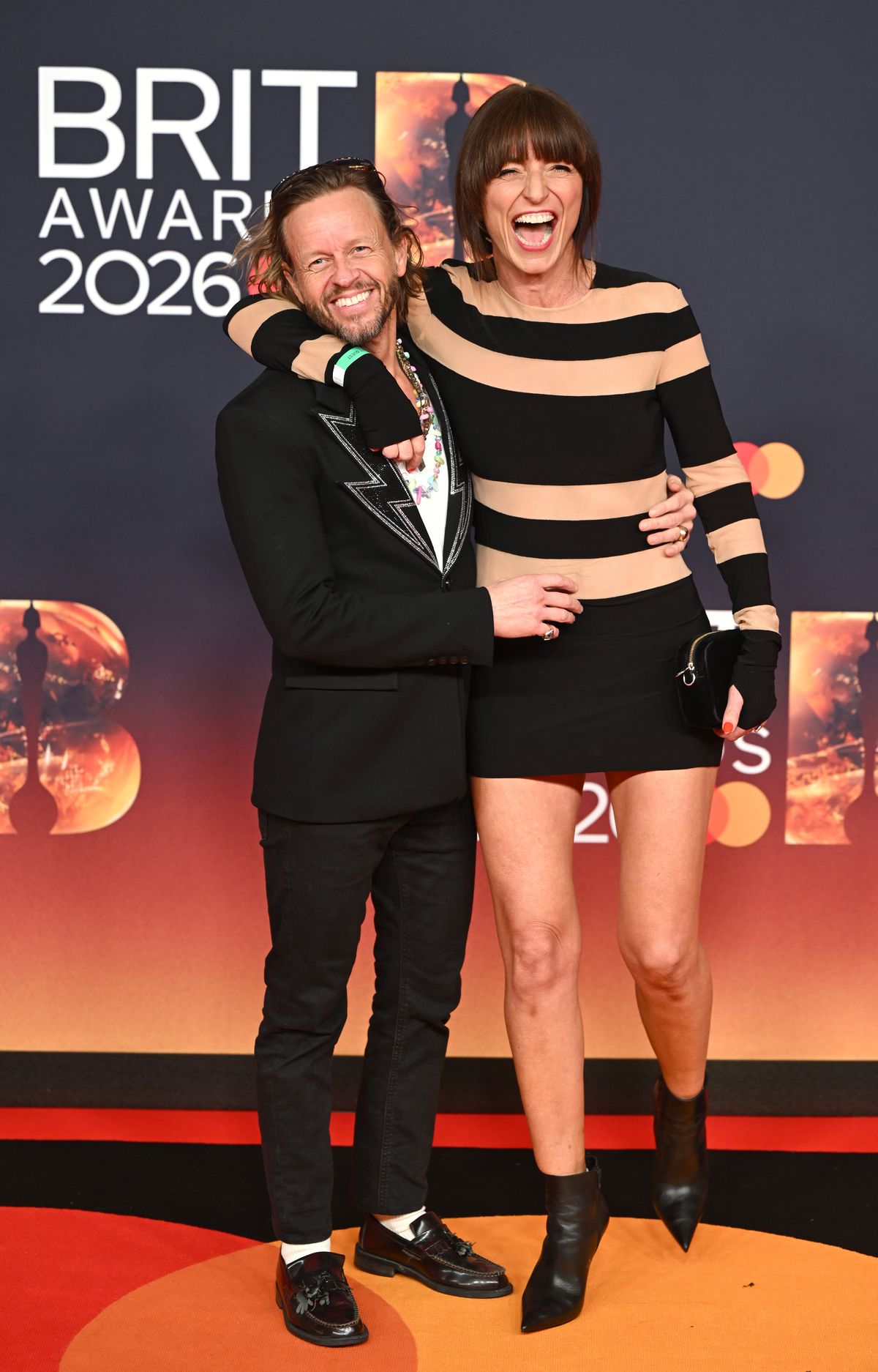 MANCHESTER, ENGLAND - FEBRUARY 28: (EDITORIAL USE ONLY) Michael Douglas and Davina McCall attend The BRIT Awards 2026 at Co-op Live on February 28, 2026 in Manchester, England. (Photo by Samir Hussein/WireImage)