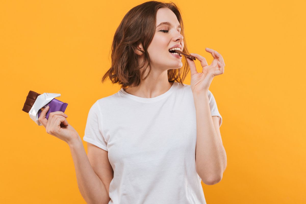 single woman eating chocolate