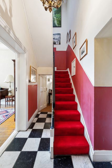 The hall and stairs at Glanmore Castle