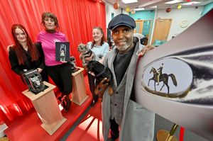 Wednesfield born sculptor Willard Wigan visited the Cornbow Centre, Halesowen to help raise funds for, and launch the community hub of: Monarch's Mutts Dog Rescue. 
He also showed off his latest sculpture, a Peaky Blinders character on a horse.  
(Front)( Willard with dog: Mitzie, and at the back (L-R) volunteer Brodie Sadler, and founders Lucy and Kate Antill with dog  Tiny Tim.
