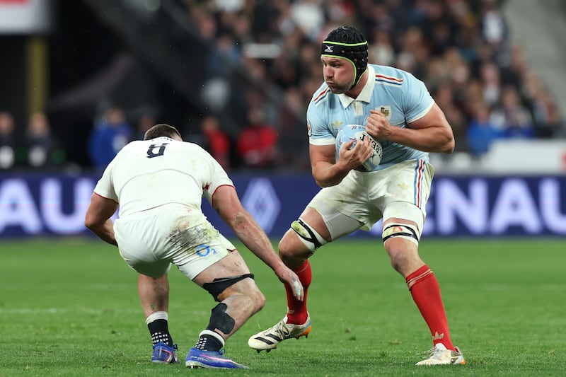 Francois Cros of France runs at England's Ben Earl during the game at Stade de France. Photograph: David Rogers/Getty Images