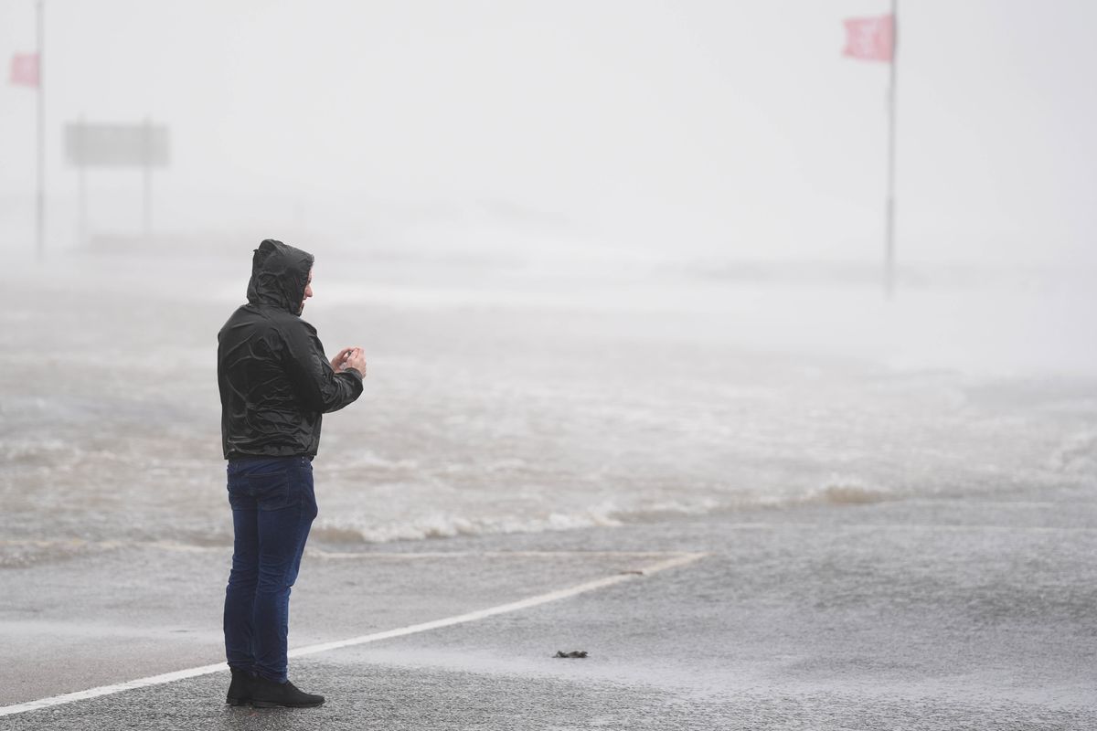A person looks at a flooded road in Galway (file photo)