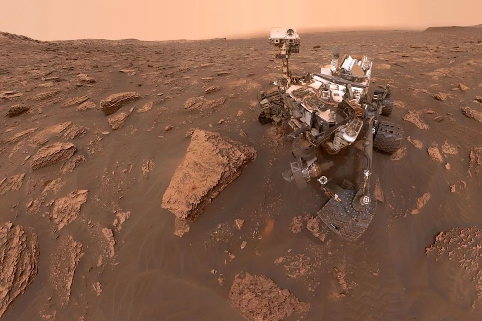 A self-portrait of NASA's Curiosity Mars rover shows the robot at a drilled sample site called