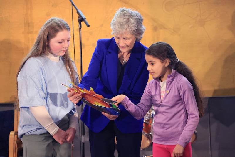 Helen Greene and Saoirse Shahzad with President Catherine Connolly  at the opening of the National Young Carers Conference in the O’Reilly Hall, University College Dublin on Saturday. Photograph: Dara Mac Dónaill