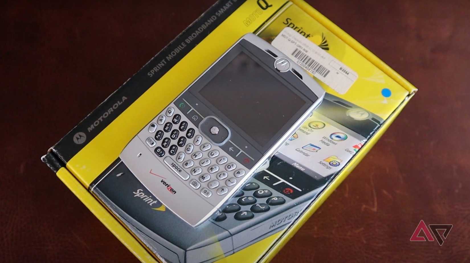 Motorola Q sitting on a box of another Motorola Q