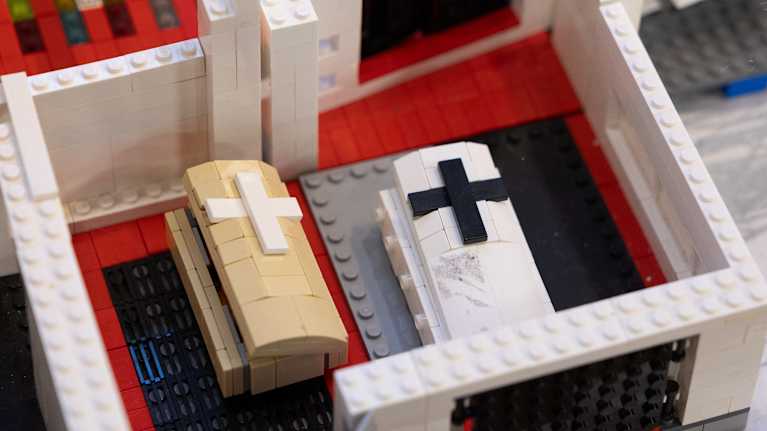 A church and coffins made of legos.