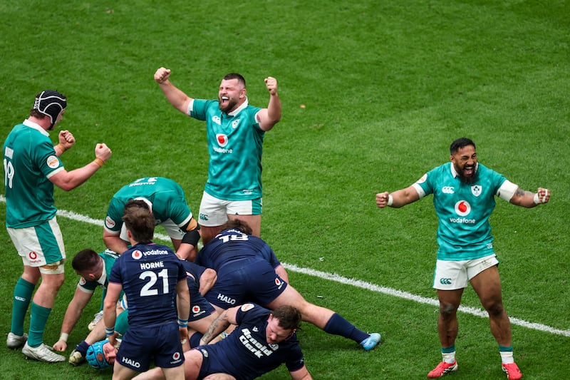Ireland's Darragh Murray, Michael Milne and Bundee Aki celebrate a turnover. Photograph: Inpho
