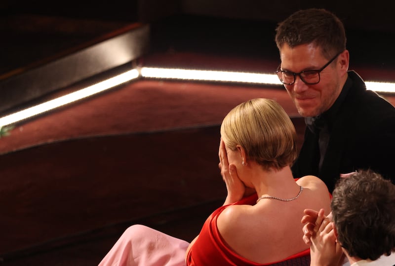 Oscars 2026: Jessie Buckley with her husband, Freddie Sorensen, as her best-actress win is announced. Photograph: Patrick T Fallon/AFP via Getty
