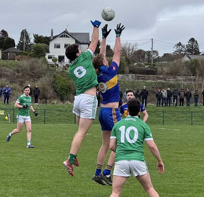 Ballincollig's Sean Dore and Carrigaline's Pa Mellett contest the high ball.