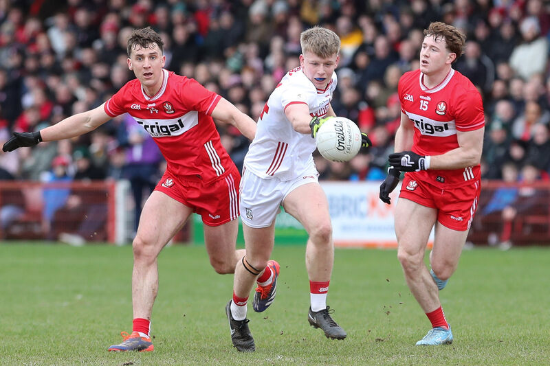 Cork’s Dara Sheedy with Derry’s Shane McGuigan and Matthew Downey. Picture: INPHO/Lorcan Doherty