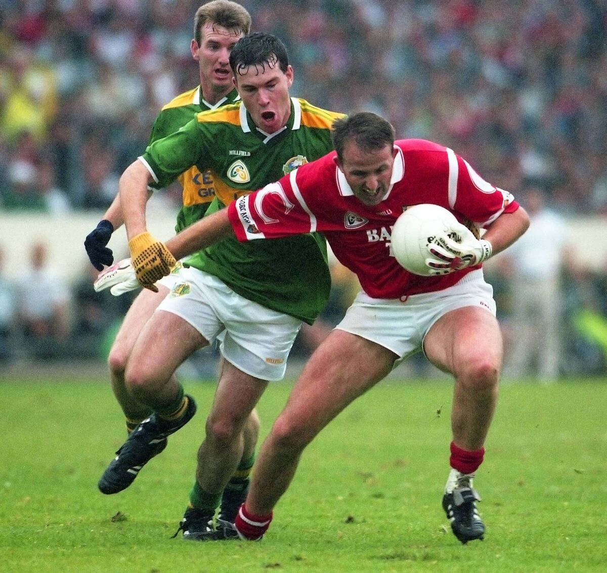 Cork's Colin Corkery is chased by Charlie McCarthy and Sean Burke of Kerry in Munster football championship action. Picture: INPHO/Matt Browne
