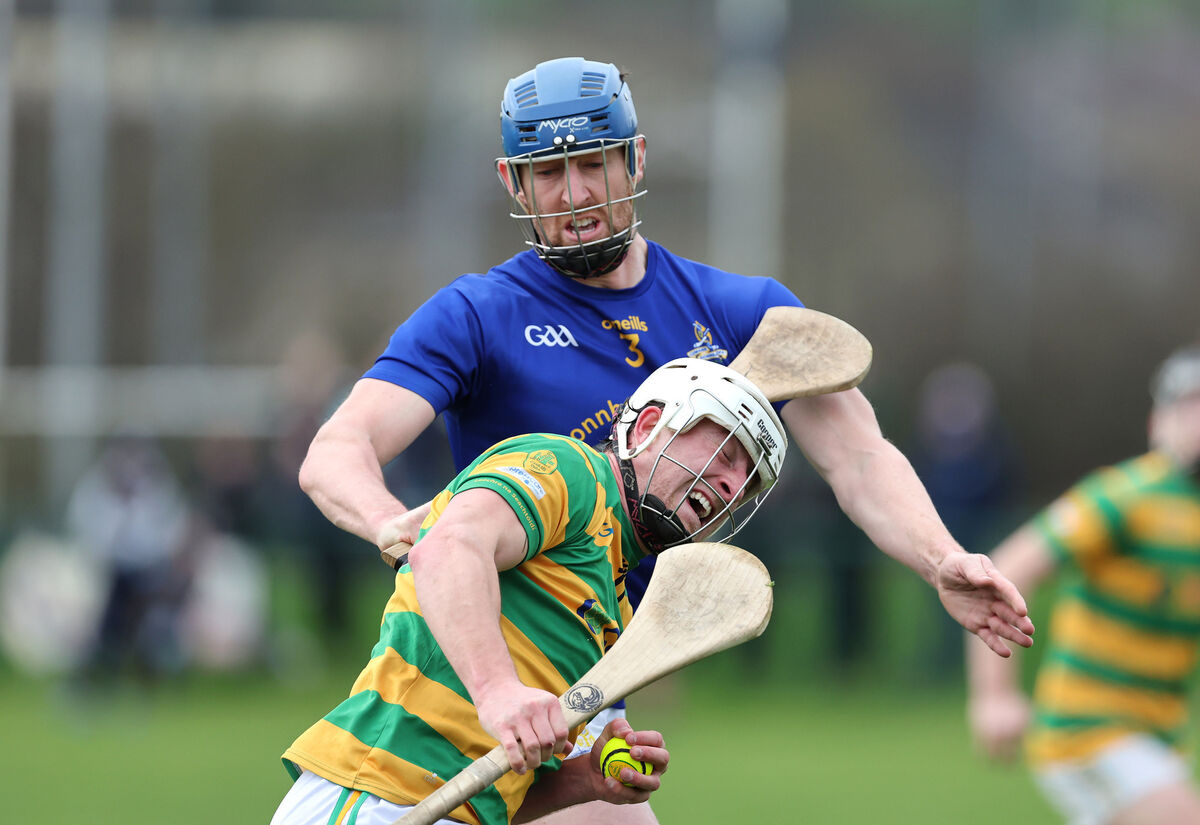  Jamie Burns, St Finbarr's, tries to hold up Robbie Cotter, Blackrock. Picture: Jim Coughlan.