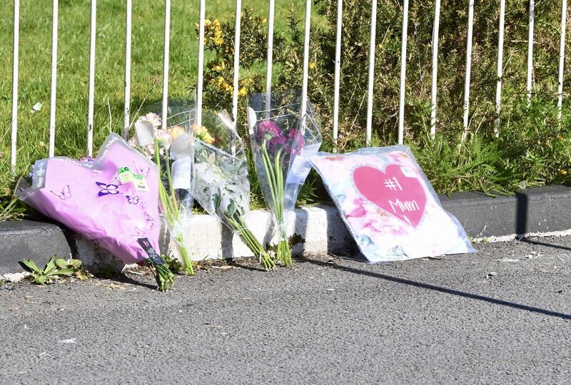  Flowers left at the scene. Picture: Larry Cummins