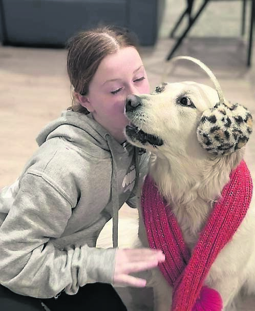 Paul Heron’s daughter Emily with Aussie. “The rhythm of life here is different,” he says. “I get to laugh more, enjoy my kids, coach, and still have time to breathe.”