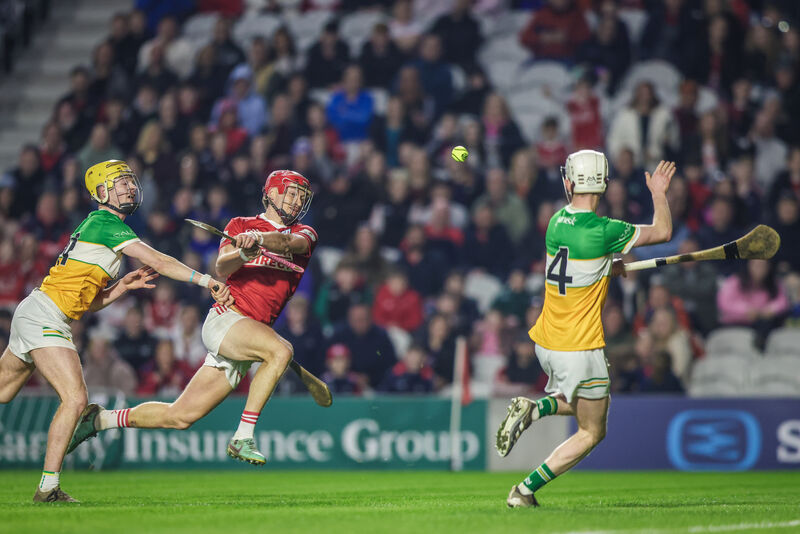 Cork's Alan Connolly gets a shot in as Offaly's Brecon Kavanagh looks to block. Picture: Inpho/David Ribeiro