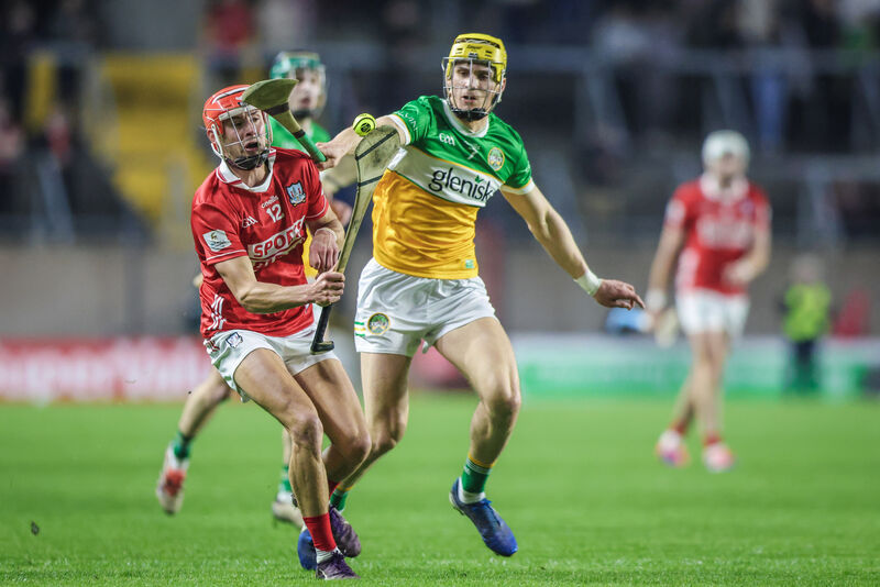 Hugh O'Connor of Cork in possession, shadowed by Donal Shirley of Offaly. Picture: Inpho/David Ribeiro