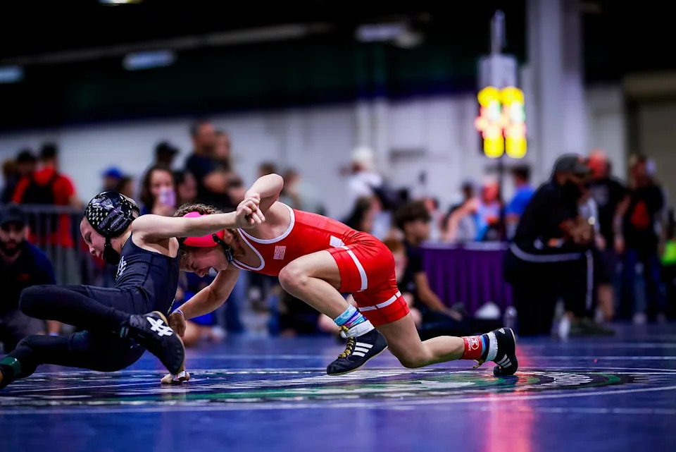 Lucy Milgrim, 9, right, takes on a wrestling component. Milgrim went viral in March 2026 for a social media video of her deadlifting 180 pounds during a USA Powerlifting competition.