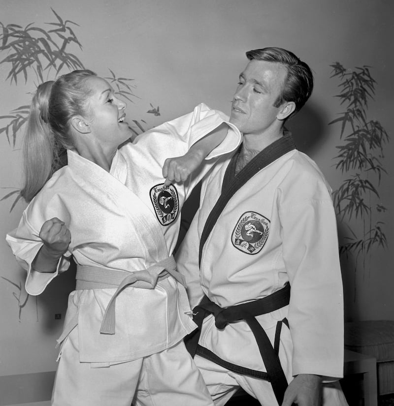 Debbie Reynolds joking around with US actor and martial artist Chuck Norris at the Stardust in Las Vegas, 1967. Photograph: EPA