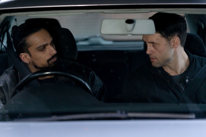 Ravi and Mark in a car in a scene from EastEnders