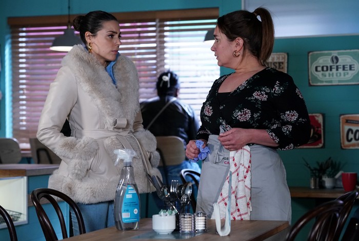 Priya chats to Vicki in the cafe in a scene from EastEnders