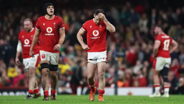 Wales players dejected after loss to Ireland last year