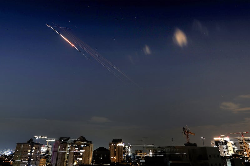 Rocket trails are seen in the sky above Netanya, Israel, on Saturday. Photograph: Jack Guez/AFP via Getty