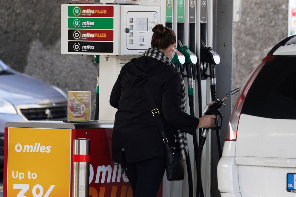 10/03/22 - A woman at a fuel pump in a Circle K service station on Glasnevin Avenue in Dublin