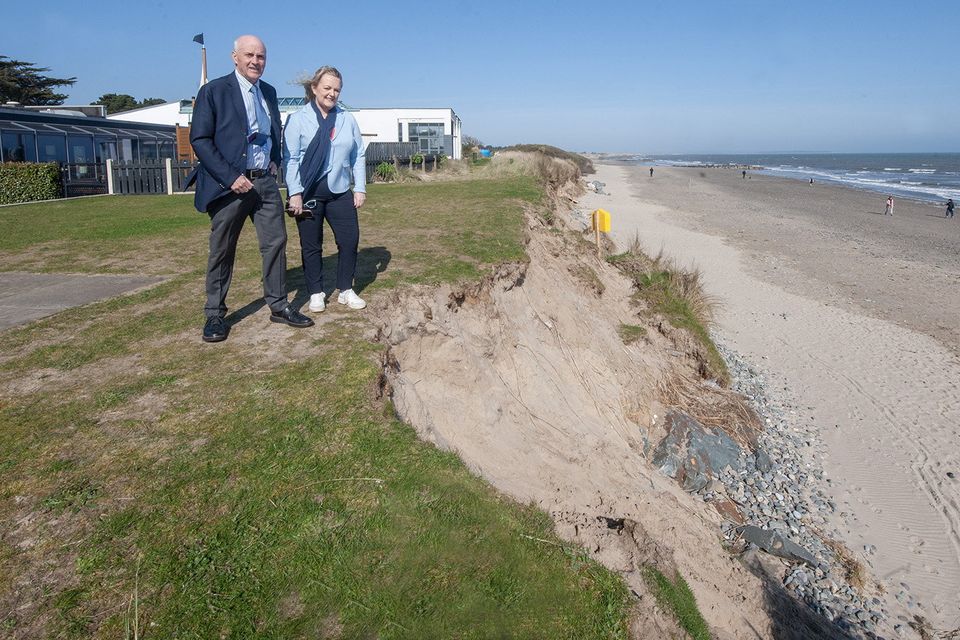 Billy Kelly and Cllr Lisa McDonald at the back of Kelly's Resort Hotel where the erosion is evident.  Photo: Jim Campbell


