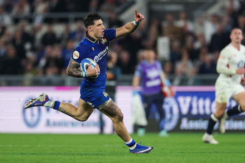 Italy's Tommaso Menoncello on his way to scoring a try against England at Stadio Olimpico in Rome. Photograph: Inpho