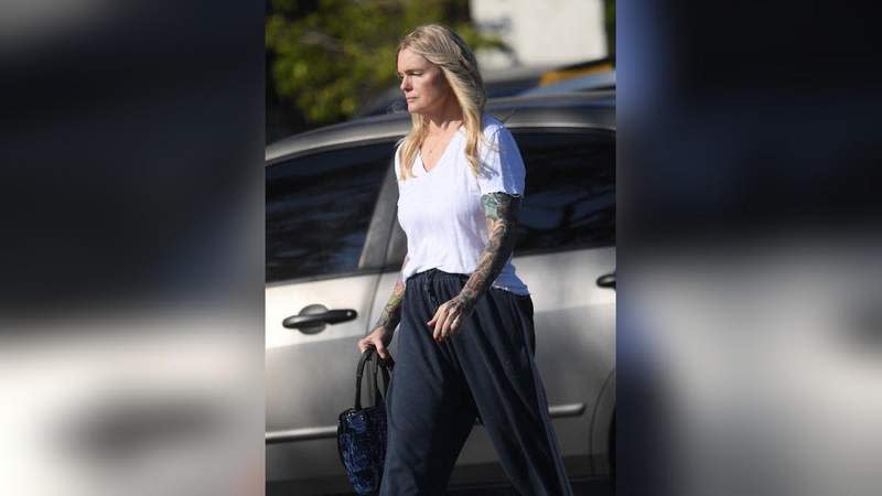 Eleniak kept her look very casual in a white T-shirt and loose navy sweatpants with slip-on shoes.MEGA