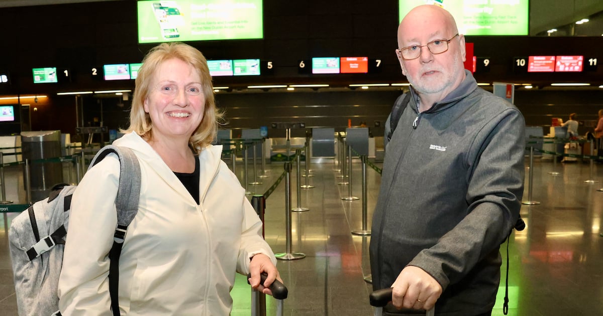 At Dublin Airport, a stream of passengers queue for the flight to Dubai – The Irish Times