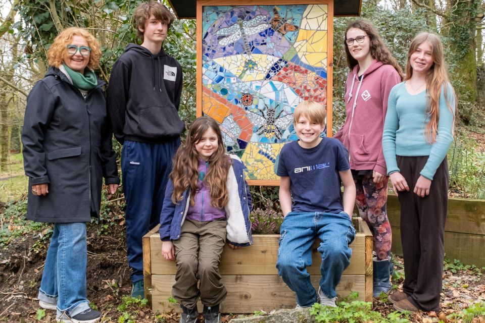 Ceramic artist Laura O'Hagan with Evan Cullen, Sylva Sepight Murphy, Aaron Cullen, Theia Speight Murphy and Sophie Schriever with one of the two mosaics unveiled.