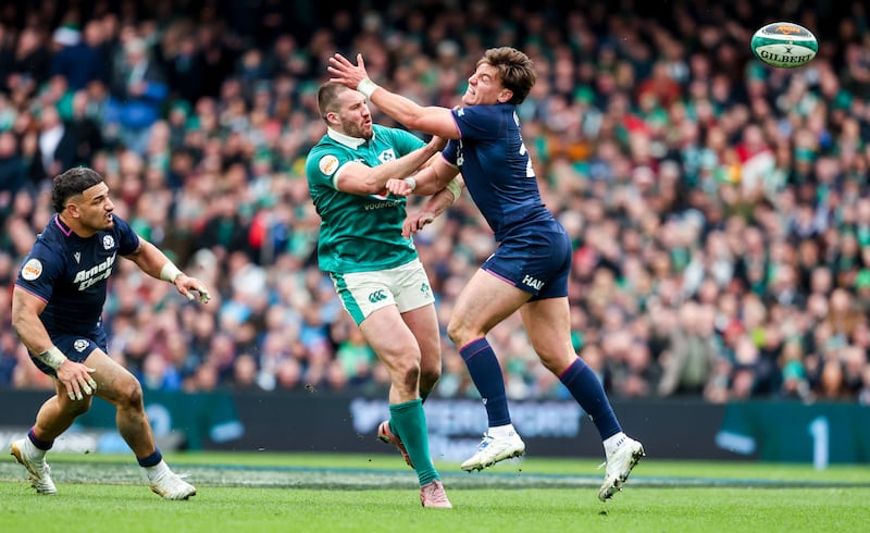 Stuart McCloskey gets a pass away for Tommy O'Brien to score Ireland's final try in the victory over Scotland at the Aviva Stadium. Photograph: Nick Elliott/Inpho